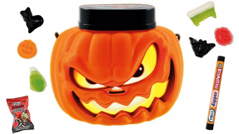 Imagen de un envase en forma de calabaza relleno de dulces. Aldi Imagen de un envase en forma de calabaza relleno de dulces. Aldi