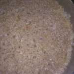 Arroz a banda de rabo de buey y ensalada de rúcula con queso de cabra