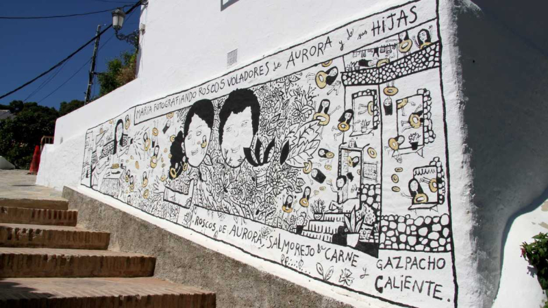Los muros de las casas de Genalguacil se convierten en lienzos donde pintar obras de arte. pueblomuseo.com