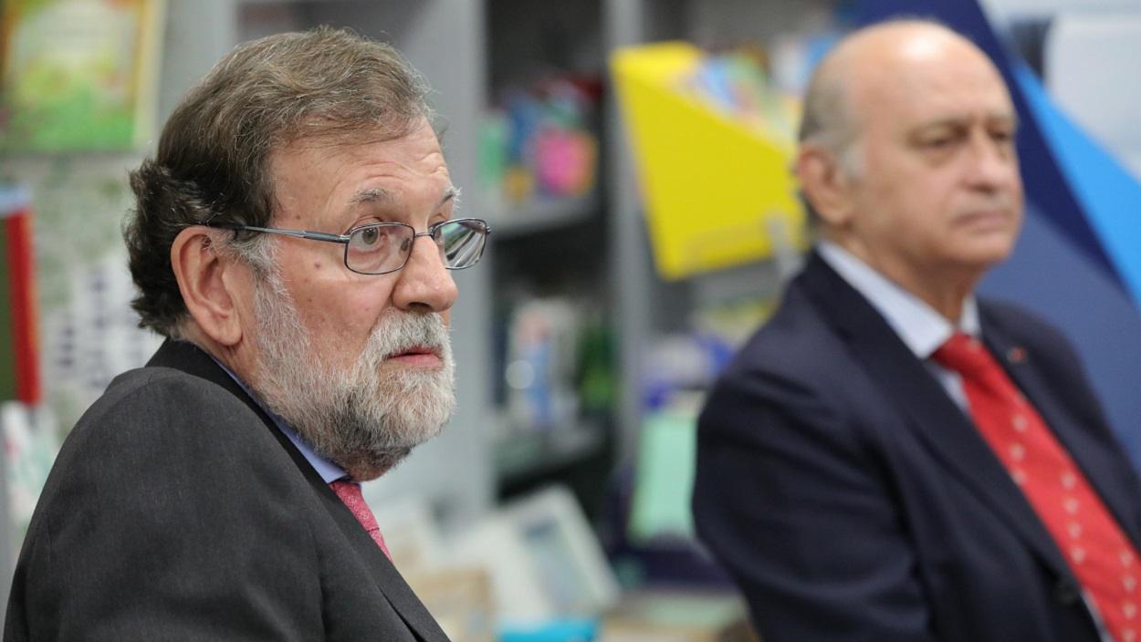 Mariano Rajoy, expresidente del Gobierno del PP, y Jorge Fernández Díaz, exministro de Interior. EP