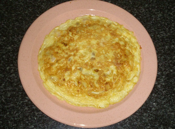 Tortilla de patatas fritas de fábrica y arroz con  palometa y puerros 