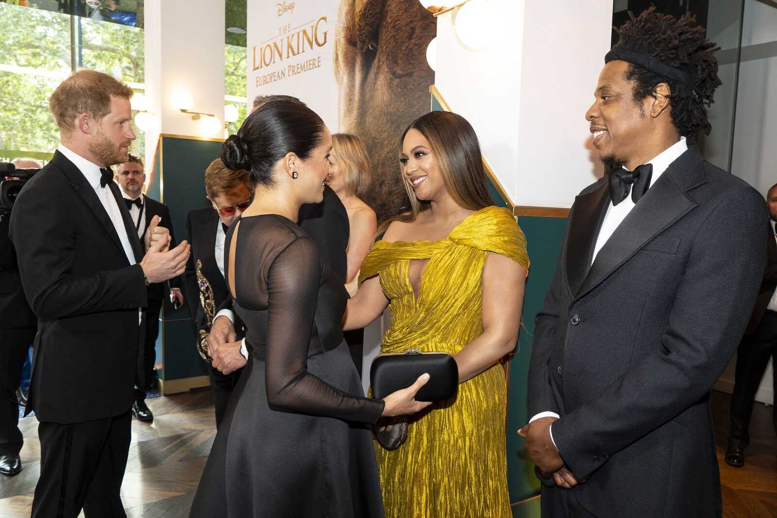 Britain’s Prince Harry, Duke of Sussex (L) and Britain’s Meghan, Duchess of Sussex (2nd L) meets cast and crew, including US singer-songwriter Beyoncé (C) and her husband, US rapper Jay-Z (R) as they attend the European premiere of the film The Lion King in London on July 14, 2019. (Photo by Niklas HALLE’N / POOL / AFP)        (Photo credit should read NIKLAS HALLE’N/AFP/Getty Images)
