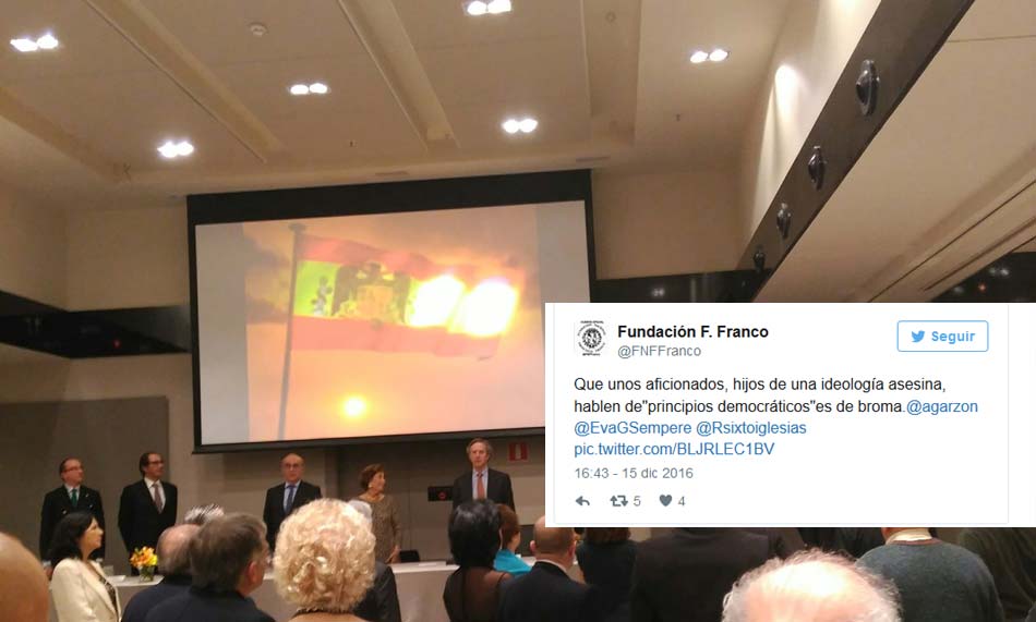 Tuit de la Fundación Francisco Franco dirigido a los diputados de Izquierda Unida con imagen de su cena conmemorativa al fondo