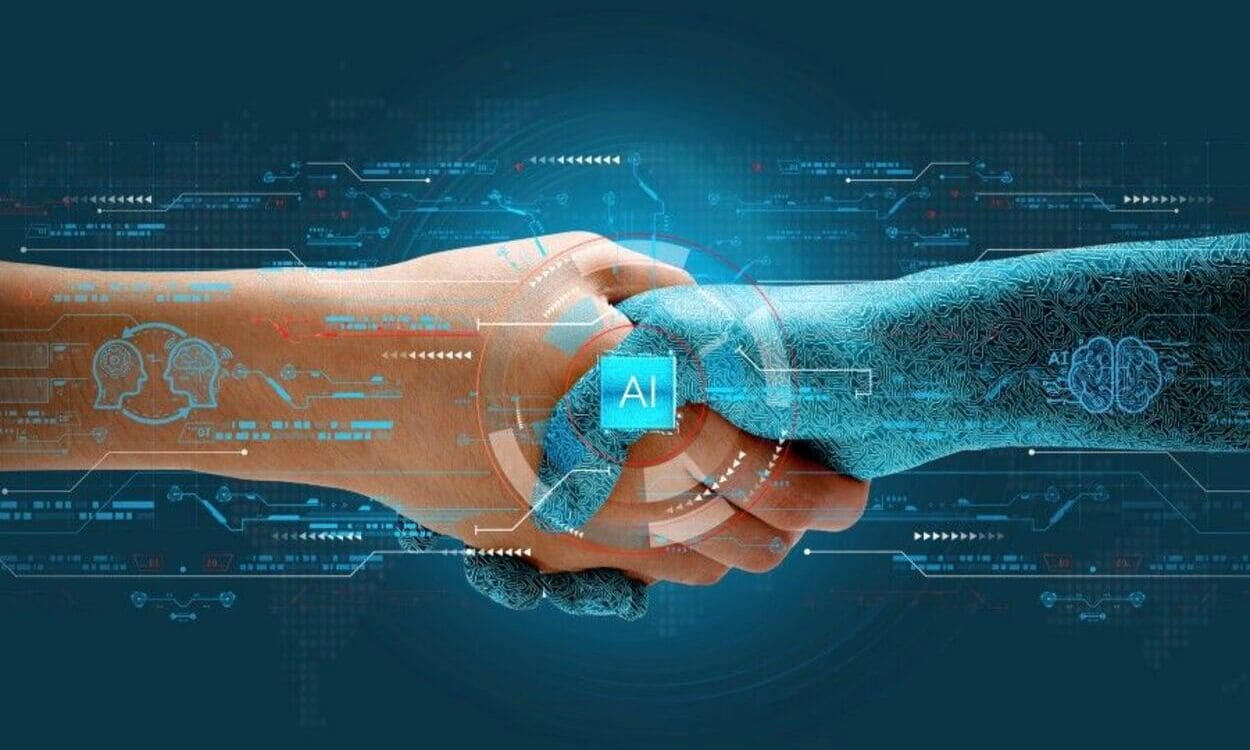 Don brazos se dan la mano bajo un símbolo de inteligencia artificial. SERVIMEDIA