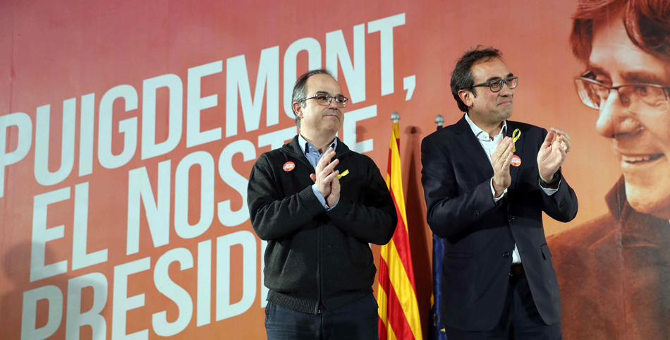 Los exconsellers y candidatos de JxSí Jordi Turull y Josep Rull (d) durante un acto