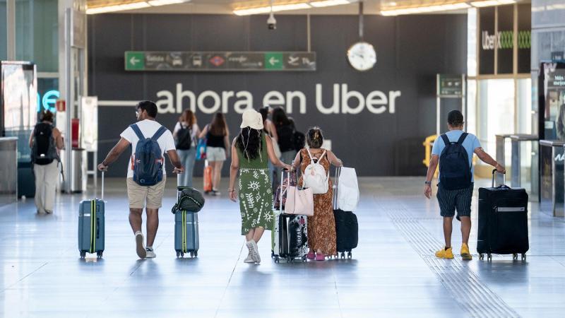 Viajeros en la Estación de Madrid Puerta de Atocha Almudena Grandes, a 30 de agosto de 2026, en Madrid
