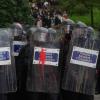Los Mossos d'Escuadra en formación con pintura y huevos que han tirado los manifestantes , durante una concentración convocada contra el agitador Vito Quiles en la UAB, a 19 de octubre de 2026. EP.