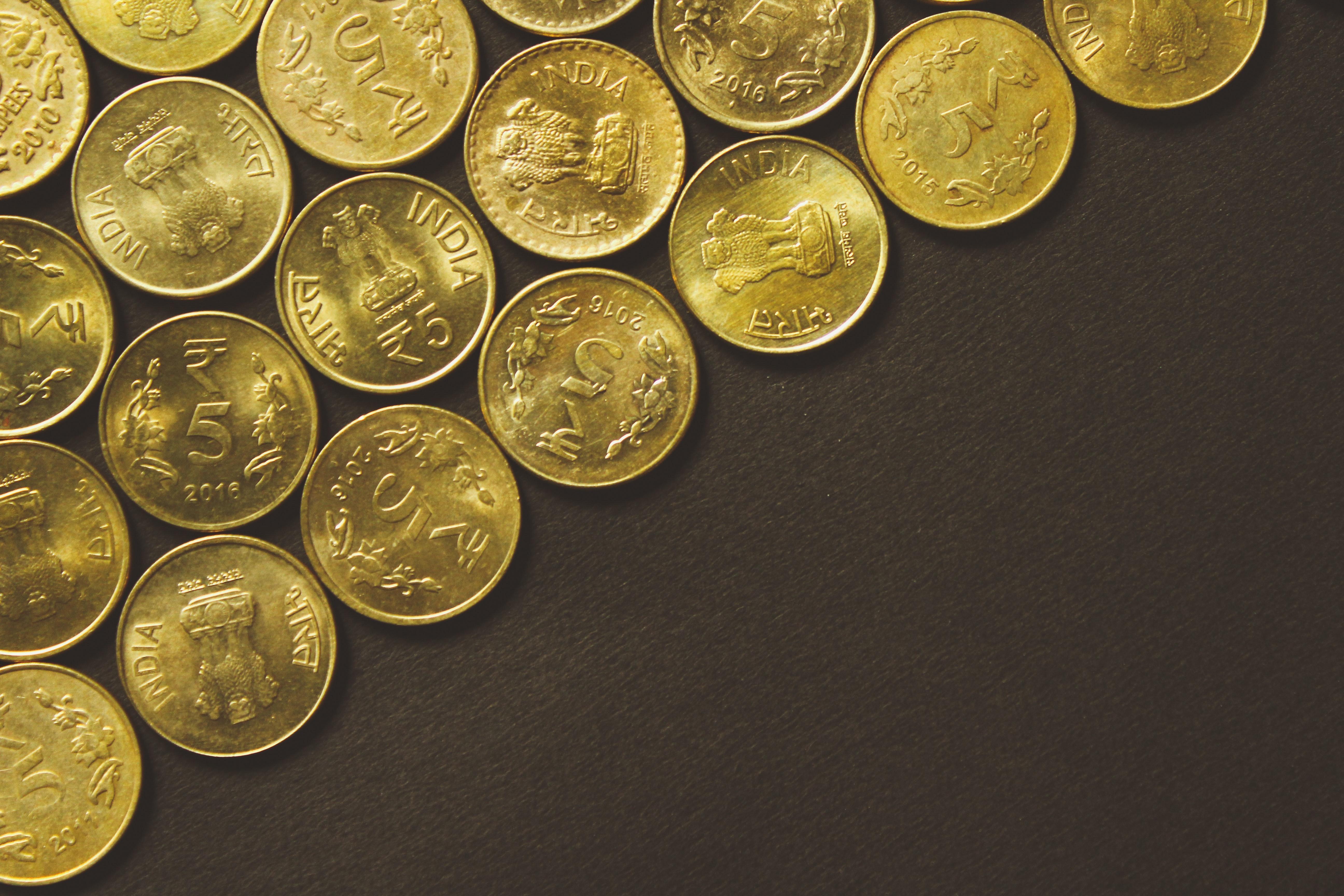 Varias monedas de oro. Unsplash